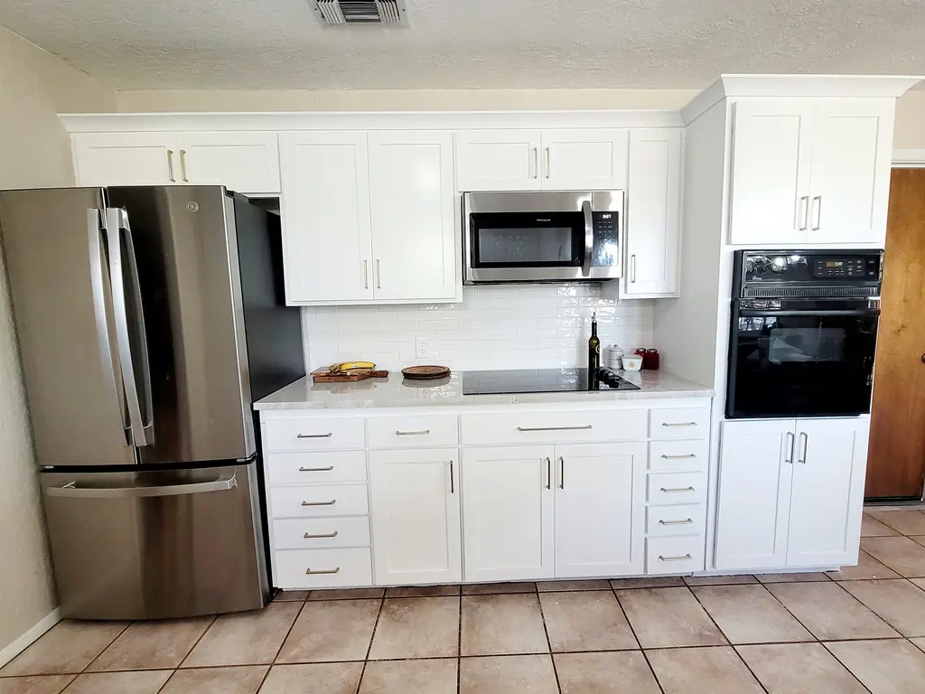Refaced kitchen cabinets around a range